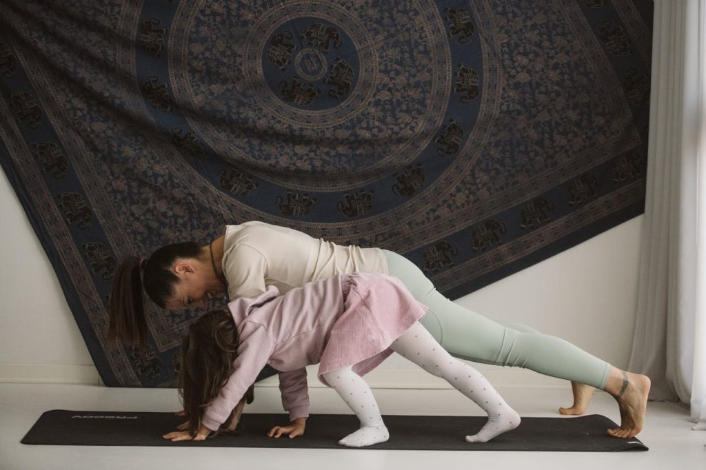 Crafting Captivating Headlines: Your awesome post title goes here A mother and child practicing yoga together indoors, showcasing family bonding and wellness.