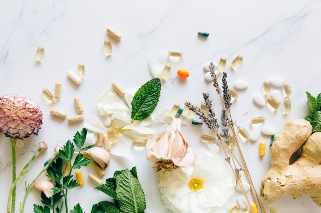 Mastering the First Impression: Your intriguing post title goes here A flatlay of natural herbs, supplements, and flowers on a marble background.